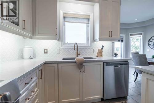 Custom counters, dual sinks, premium appliances - 51 Showcase Drive, Hamilton, ON - Indoor Photo Showing Kitchen With Upgraded Kitchen