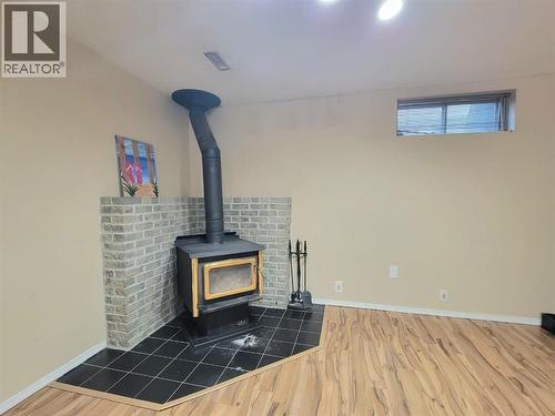 8101 Mission Heights Drive, Grande Prairie, AB - Indoor Photo Showing Other Room With Fireplace