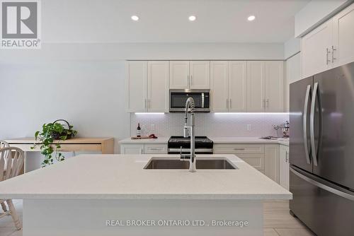 69 Miranda Path, Woolwich, ON - Indoor Photo Showing Kitchen With Stainless Steel Kitchen With Upgraded Kitchen