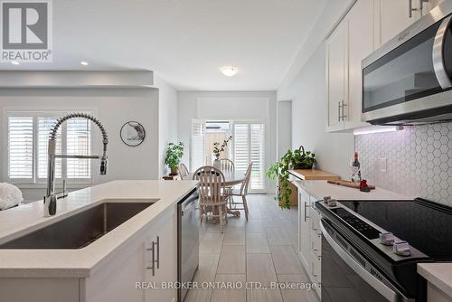 69 Miranda Path, Woolwich, ON - Indoor Photo Showing Kitchen With Upgraded Kitchen