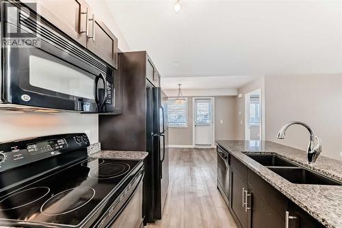 11302, 2781 Chinook Winds Drive Sw, Airdrie, AB - Indoor Photo Showing Kitchen With Double Sink