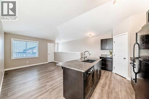 11302, 2781 Chinook Winds Drive Sw, Airdrie, AB - Indoor Photo Showing Kitchen With Double Sink With Upgraded Kitchen
