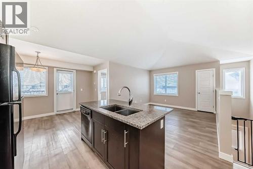 Current Living Room - 11302, 2781 Chinook Winds Drive Sw, Airdrie, AB - Indoor Photo Showing Kitchen With Double Sink