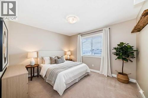 Staged Primary Bedroom - 11302, 2781 Chinook Winds Drive Sw, Airdrie, AB - Indoor Photo Showing Bedroom