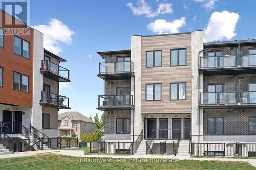 34 - 10 South Creek Drive, Kitchener, ON - Outdoor With Balcony With Facade