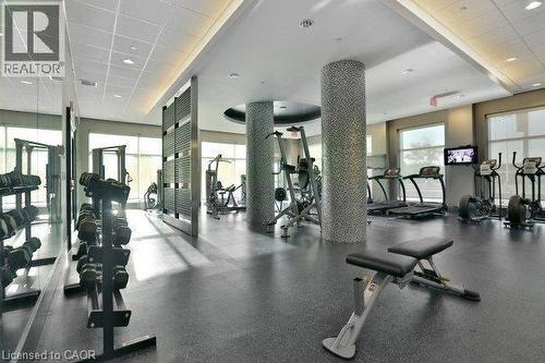 View of workout area - 55 Speers Road Unit# 415, Oakville, ON - Indoor Photo Showing Gym Room