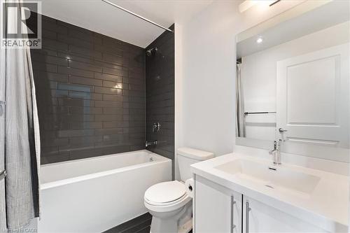 Full bathroom with shower / bath combo with shower curtain, vanity, and recessed lighting - 55 Speers Road Unit# 415, Oakville, ON - Indoor Photo Showing Bathroom