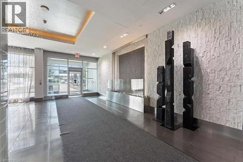 View of community lobby - 55 Speers Road Unit# 415, Oakville, ON - Indoor Photo Showing Other Room