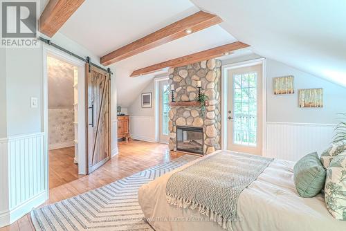 7725 Leskard Road N, Clarington, ON - Indoor Photo Showing Bedroom With Fireplace