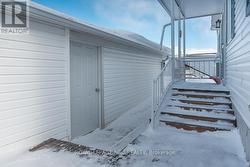 Rear Entry to home. Man door to garage - 