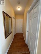 Unit hallway to bedrooms and main bath - 