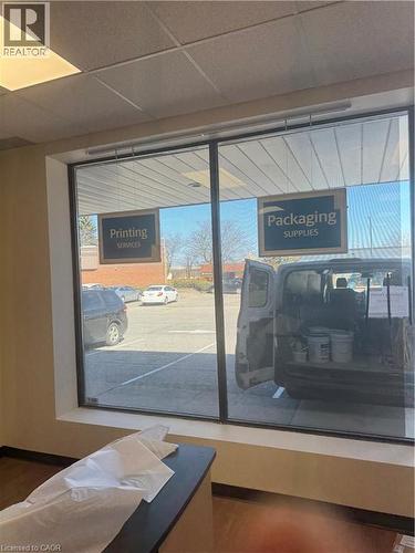 Detailed view of a paneled ceiling and baseboards - 2 Tremont Drive Unit# F03, St. Catharines, ON 