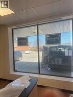 Detailed view of a paneled ceiling and baseboards - 