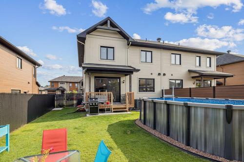Face arrière - 312 Ch. Jean-Paul-Lemieux, Chelsea, QC - Outdoor With Above Ground Pool With Backyard With Exterior