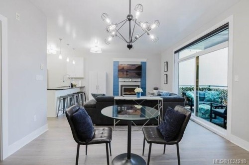 201-606 Speed Ave, Victoria, BC - Indoor Photo Showing Dining Room With Fireplace