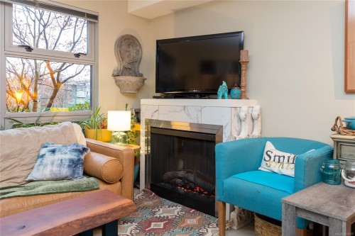 109-797 Tyee Rd, Victoria, BC - Indoor Photo Showing Living Room With Fireplace