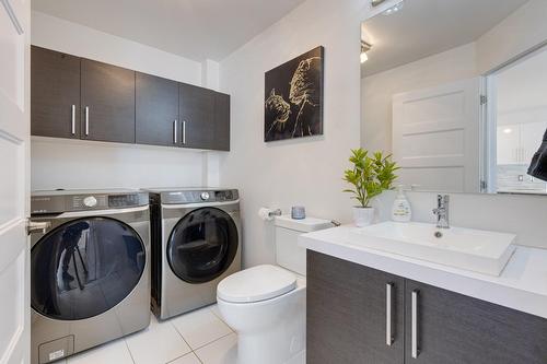 Salle d'eau - 33A Av. Sauriol, Laval (Laval-Des-Rapides), QC - Indoor Photo Showing Laundry Room