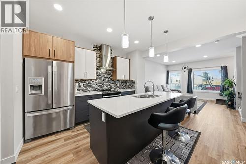 705 Evergreen Boulevard, Saskatoon, SK - Indoor Photo Showing Kitchen With Stainless Steel Kitchen With Double Sink With Upgraded Kitchen