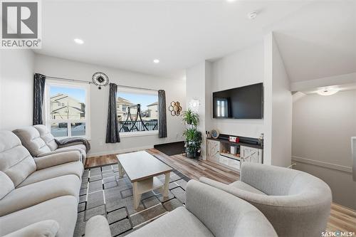 705 Evergreen Boulevard, Saskatoon, SK - Indoor Photo Showing Living Room With Fireplace