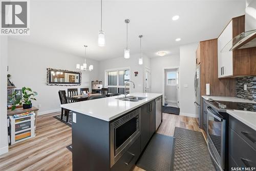 705 Evergreen Boulevard, Saskatoon, SK - Indoor Photo Showing Kitchen With Stainless Steel Kitchen With Double Sink With Upgraded Kitchen