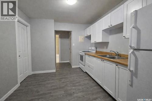 1411 111Th Street, North Battleford, SK - Indoor Photo Showing Kitchen With Double Sink