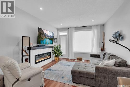 206 3581 Evans Court, Regina, SK - Indoor Photo Showing Living Room With Fireplace