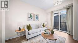 Living area featuring wood finished floors - 