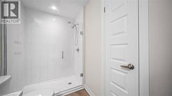 Full bathroom with a shower stall and toilet - 