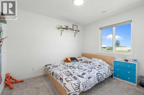36 Magnolia Bay Se, Calgary, AB - Indoor Photo Showing Bedroom