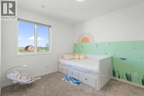 36 Magnolia Bay Se, Calgary, AB - Indoor Photo Showing Bedroom