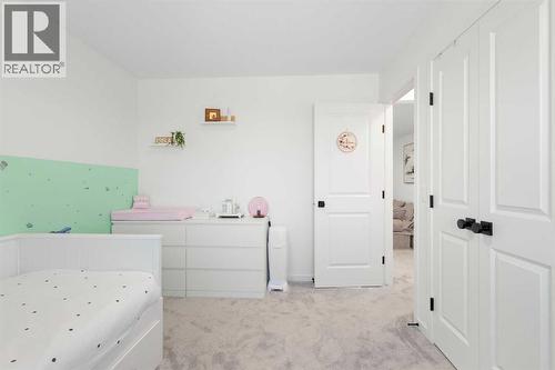 36 Magnolia Bay Se, Calgary, AB - Indoor Photo Showing Bedroom