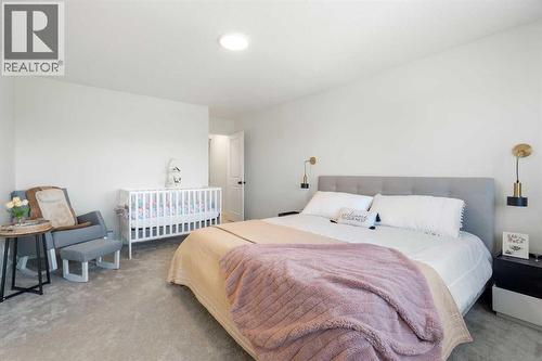 36 Magnolia Bay Se, Calgary, AB - Indoor Photo Showing Bedroom