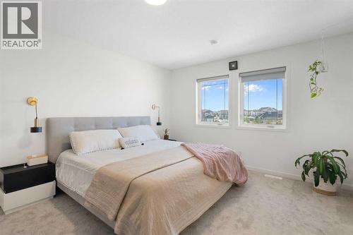 36 Magnolia Bay Se, Calgary, AB - Indoor Photo Showing Bedroom
