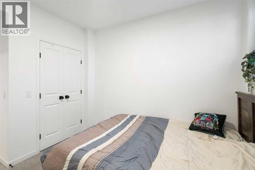 36 Magnolia Bay Se, Calgary, AB - Indoor Photo Showing Bedroom