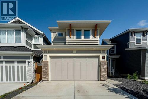 36 Magnolia Bay Se, Calgary, AB - Outdoor With Facade