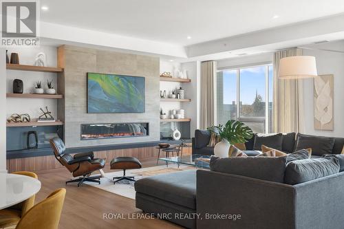 601 - 77 Yates Street, St. Catharines (Downtown), ON - Indoor Photo Showing Living Room With Fireplace