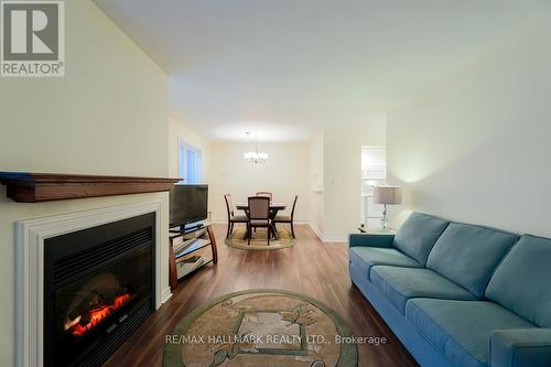 201 - 193 Lake Driveway Drive W, Ajax, ON - Indoor Photo Showing Living Room With Fireplace