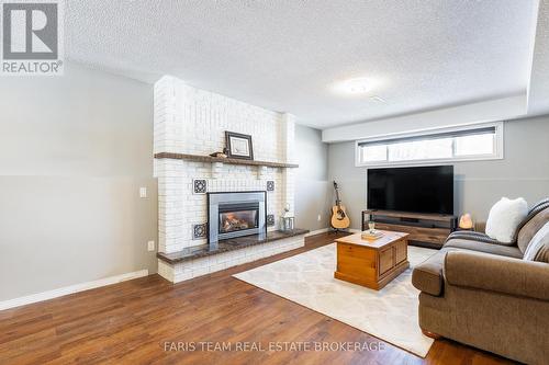 52 Roth Street, Essa, ON - Indoor Photo Showing Living Room With Fireplace