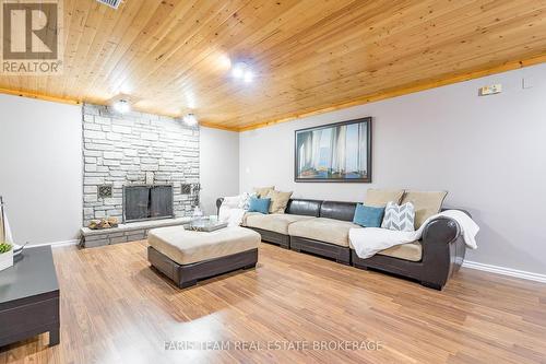 21 Maryjane Road, Tiny, ON - Indoor Photo Showing Living Room With Fireplace