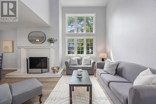 Living Room with big windows and south sunlight - 37 - 146 Settler'S Way, Blue Mountains, ON - Indoor Photo Showing Living Room With Fireplace