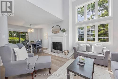 Living Room with big windows and south sunlight - 37 - 146 Settler'S Way, Blue Mountains, ON - Indoor Photo Showing Living Room With Fireplace