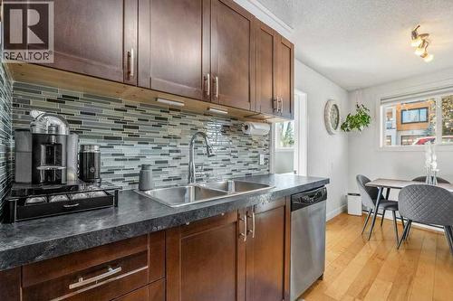 101, 312 15 Avenue Ne, Calgary, AB - Indoor Photo Showing Kitchen With Double Sink