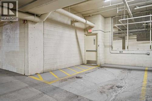 Spacious underground titled parking stall #117 - 306, 660 Eau Claire Avenue Sw, Calgary, AB - Indoor Photo Showing Garage