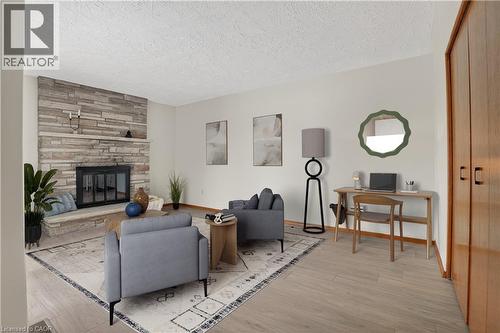 Virtually Staged - 384 Dunvegan Drive, Waterloo, ON - Indoor Photo Showing Other Room With Fireplace