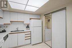 Laundry room with sliding doors separates kitchen - 