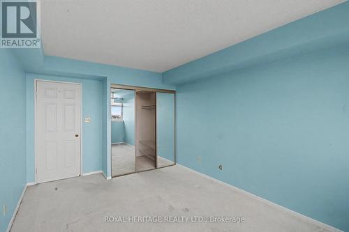 sliding doors to large walk in closet in bdrm - 509 - 30 Thunder Grove, Toronto, ON - Indoor Photo Showing Other Room