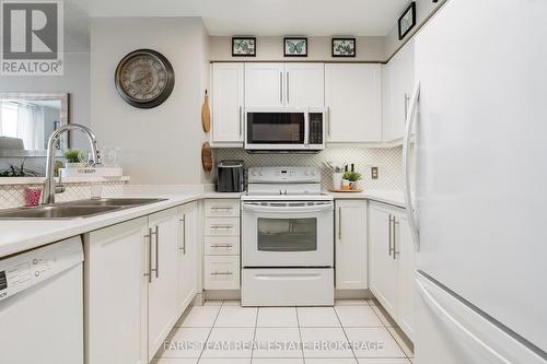 511 - 150 Dunlop Street E, Barrie, ON - Indoor Photo Showing Kitchen With Double Sink