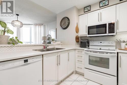 511 - 150 Dunlop Street E, Barrie, ON - Indoor Photo Showing Kitchen With Double Sink