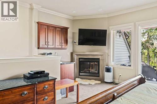 2421 Erlton Street Sw, Calgary, AB - Indoor Photo Showing Bedroom With Fireplace