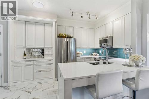 404, 881 15 Avenue Sw, Calgary, AB - Indoor Photo Showing Kitchen With Stainless Steel Kitchen With Double Sink With Upgraded Kitchen